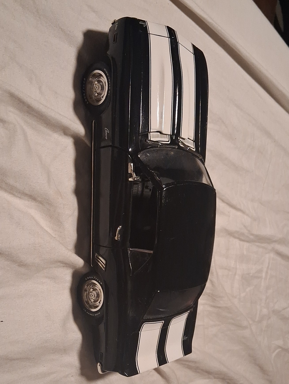 Black Model Muscle Car with White Racing Stripes